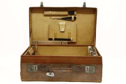 Lot 284 - A gentleman's leather dressing suitcase with contents including silver topped dressing pot