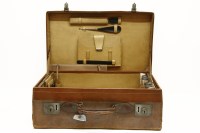 Lot 284A - A gentleman's leather dressing suitcase with contents including silver topped dressing pot