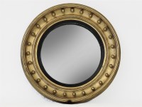 Lot 834 - A late Georgian style gilt framed convex wall mirror