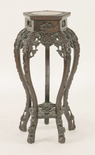Lot 252 - A Chinese rosewood vase stand
