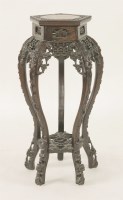 Lot 252 - A Chinese rosewood vase stand