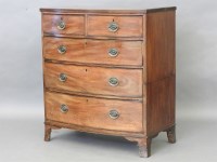 Lot 603 - A George lll mahogany bow front chest of two short over three long drawers