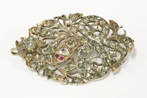 Lot 34 - An Indian (probably Sri Lankan) silver and gold zircon set floral brooch