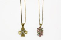 Lot 41 - A gold textured cross with diamond set cross over section
