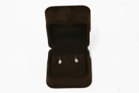 Lot 23 - A pair of white gold single stone diamond earrings
