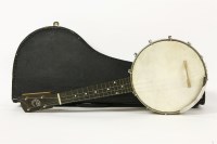 Lot 181 - A 'The Whirle' banjo ukulele in case