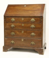 Lot 601 - A George III walnut bureau