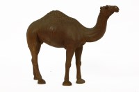 Lot 164 - A middle eastern carved wooden figure of a camel 22.5cm high