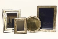 Lot 73 - A hallmarked silver photograph frame together with three other examples (4)