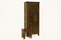 Lot 512 - A reproduction carved oak wardrobe