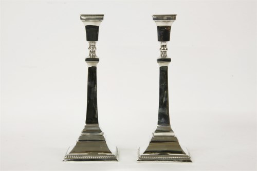 Lot 134 - A pair of silver candlesticks