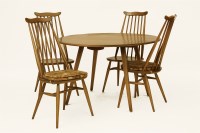 Lot 472 - An Ercol dining table and four chairs