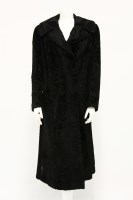 Lot 1409 - A black astrakhan full-length coat