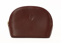 Lot 1190 - A Cartier red bordeaux leather make-up style pouch