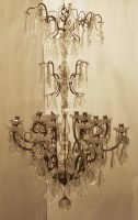 Lot 512 - A French cut glass and brass sixteen-light chandelier