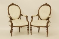 Lot 642 - A 19th century pair of Continental oak open armchairs