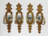 Lot 383 - A set of four two light girandole wall lights