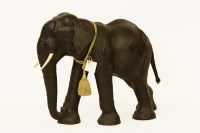 Lot 415 - A black leather elephant