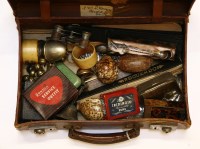 Lot 119 - A small brown case and contents