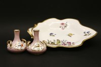 Lot 161 - A pair of small pink ground porcelain vases of squat form