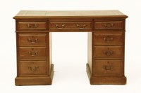 Lot 425 - A Maple & Co oak twin pedestal desk