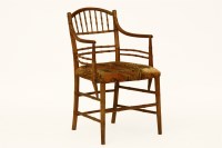 Lot 508 - A beechwood simulated bamboo elbow chair