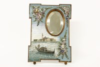 Lot 184 - A Venetian micro mosaic mirror frame decorated with gondolier scene and raised flowers 32 x 23.5cm