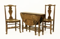 Lot 476 - A pair of 18th Century country made elm side chairs