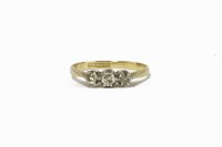 Lot 6 - A gold three stone diamond ring