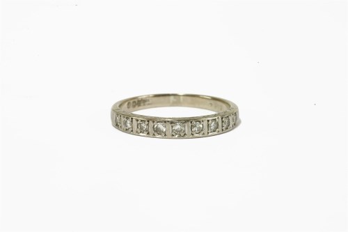 Lot 2 - A white gold diamond half eternity ring