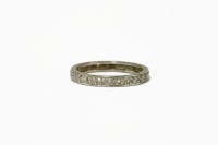 Lot 24 - A white gold half hoop diamond eternity ring