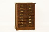 Lot 574 - An oak filing chest of 16 drawers