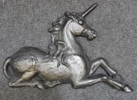 Lot 391 - An oversized cast iron door stop in the form of a unicorn 63cm wide
