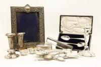 Lot 77 - A collection of silver and silver plated items to include a repousse silver photograph frame