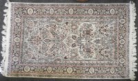 Lot 548 - A Persian silk rug