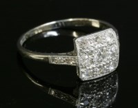 Lot 152 - An Art Deco diamond set square cluster ring