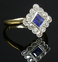 Lot 158 - An Art Deco sapphire and diamond offset square cluster ring