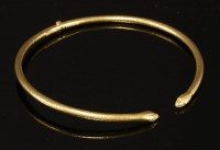 Lot 320 - A gold snake form hinged torque necklace by Ilias Lalaounis