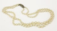 Lot 62 - A two row graduated cultured pearl necklace with silver marcasite clasp