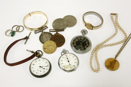 Lot 63 - A collection of costume jewellery and medals to include a rolled gold bangle with engraved decoration