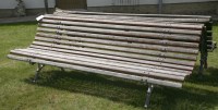 Lot 658 - A cast iron park bench