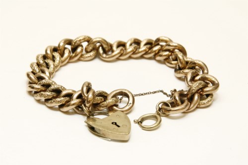 Lot 65 - A gold polished and textured hollow curb link bracelet marked 9c