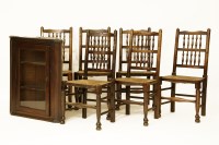 Lot 651 - Six early 20th century oak turned spindle back chairs