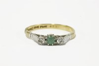 Lot 18 - A gold emerald and diamond three stone ring