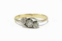 Lot 17 - A gold three stone diamond crossover ring