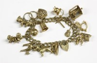 Lot 63 - A 9ct gold double curb link bracelet with padlock and sixteen assorted gold charms