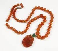Lot 49 - A Chinese single row graduated agate bead necklace