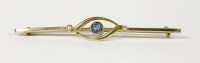 Lot 27 - An Edwardian gold single stone aquamarine and seed pearl bar brooch