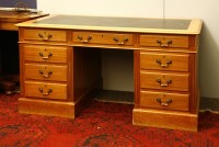 Lot 614 - A modern mahogany pedestal desk of nine drawers