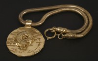 Lot 1614 - An Yves Saint Laurent gold-plated ammonite pendant